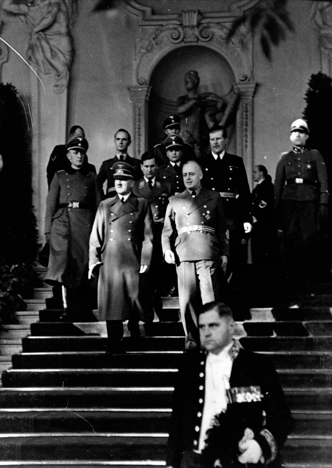 Adolf Hitler and Joachim von Ribbentrop leave Vienna's Belvedere Palace after Hungary joined the Tripartite Pact